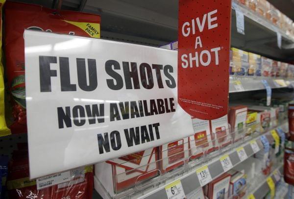 Sign promoting flu shots.