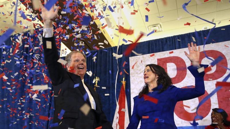 Democratic candidate for Senate Doug Jones and his wife, Louise, wave to supporters before he gave his victory speech in Birmingham, Ala., on Tuesday.