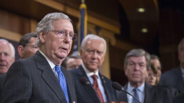 Senate Majority Leader Mitch McConnell (left) speaks at the press conference after the senate vote of the tax reform bill on Wednesday in Washington, D.C.