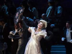 woman sings on stage as the met performs the merry widow