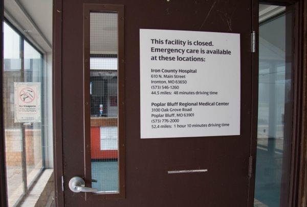 A sign on the door of the shuttered hospital in Ellington, Missouri lists the nearest facilities with functional emergency rooms and how far away they are by car.
