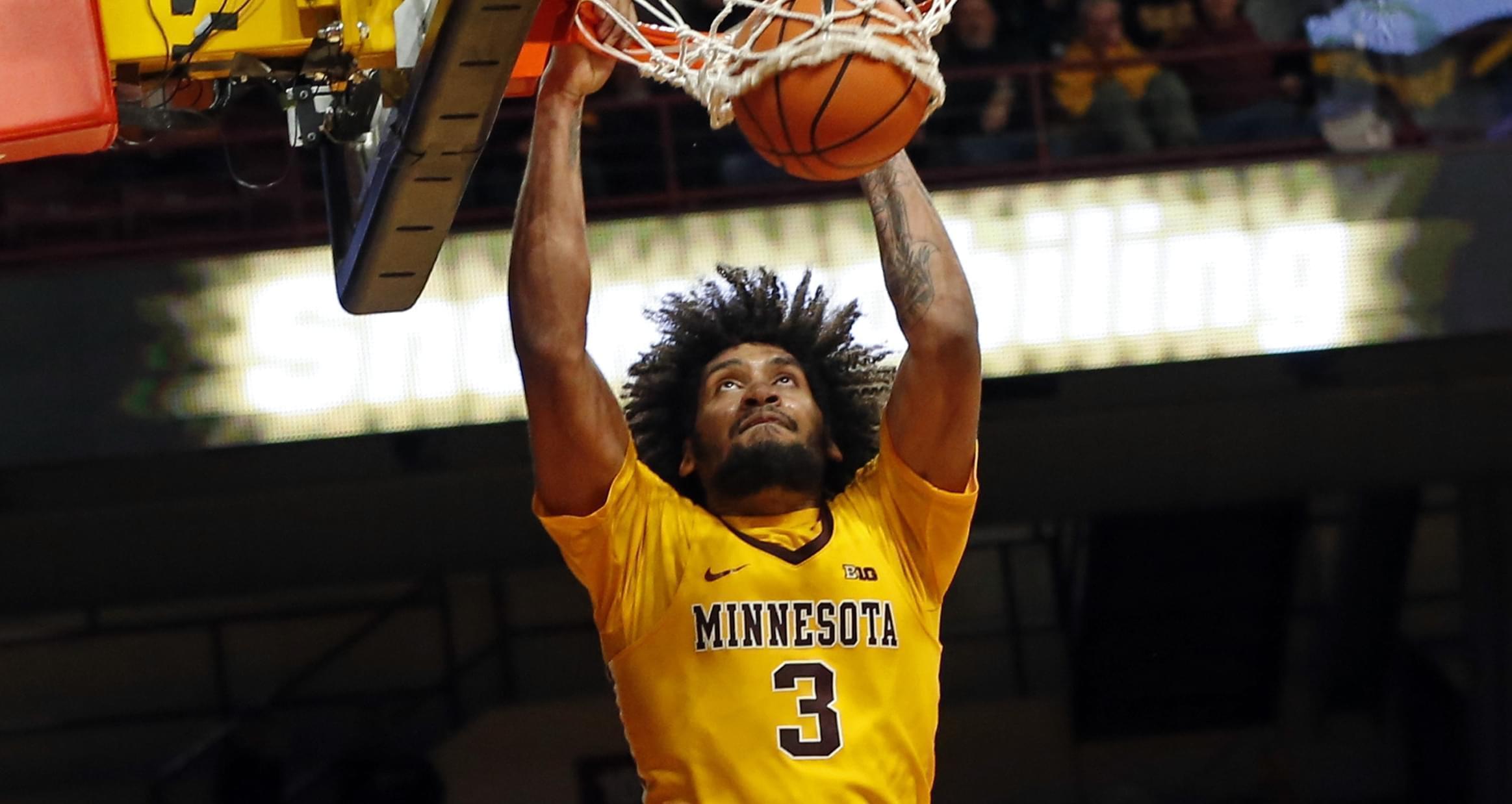 Minnesota's Jordan Murphy dunks against Illinois' in the second half of an NCAA college basketball game Wednesday, Jan. 3, 2018, in Minneapolis. 