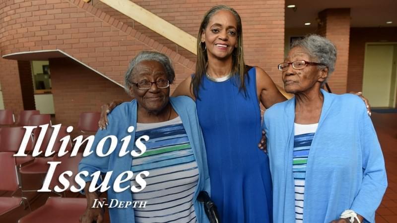 90-year-old twins Edna Mayes (left) and Ethel Sylvester, who are both residents of the East St. Louis Housing Authority, pose with East St. Louis Housing Authority Executive Director Mildred A. Motley at the Municipal Building in East St. Louis.