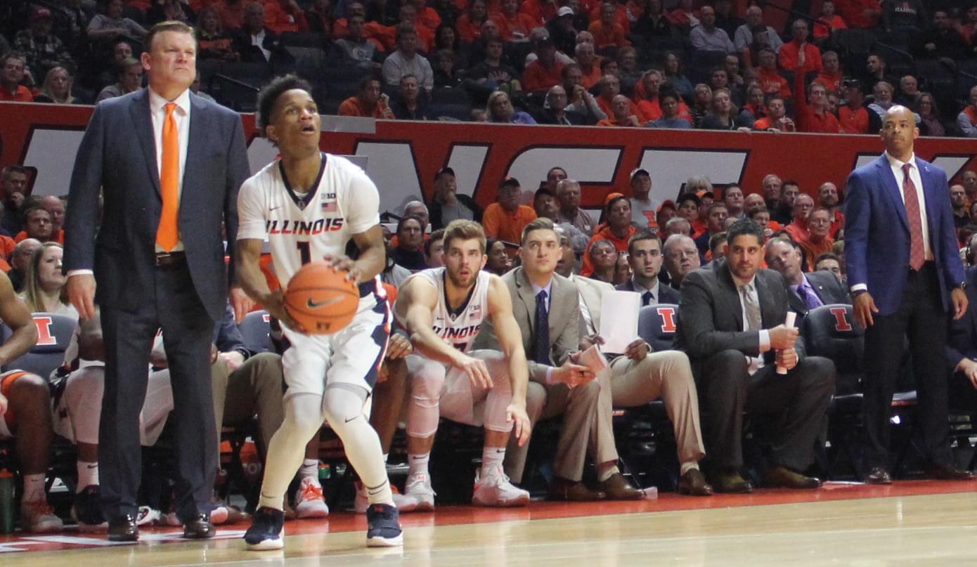 Trent Frazier shoots a three-pointer during a 104-97 overtime loss to Iowa.