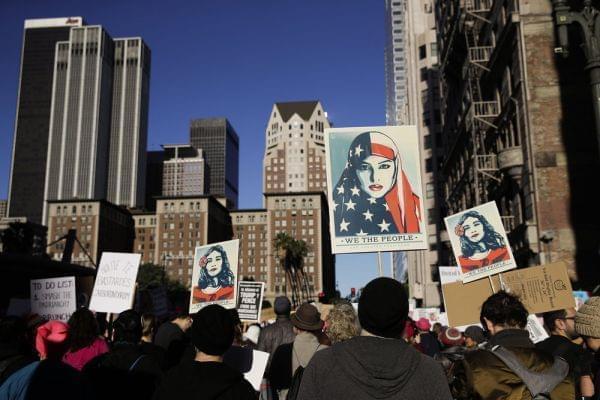 People gather for a Women's March, Saturday, Jan. 20, 2018, in Los Angeles. 