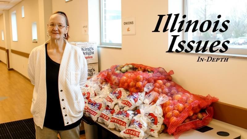 Susan Stolkes, a Springfield resident, stands in front of fresh produce being offered in January at the Central Counties Health Centers' food pantry.