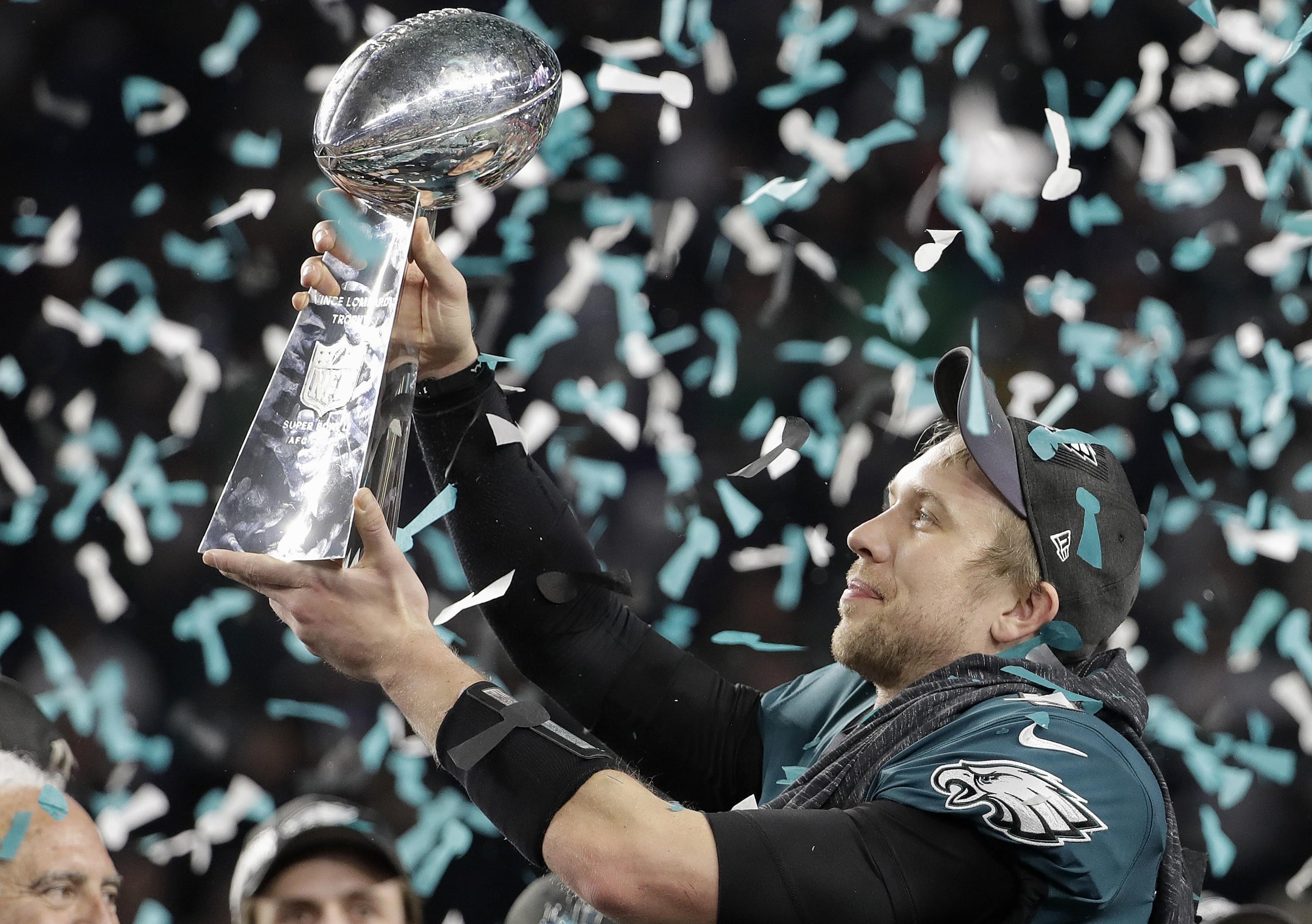 Philadelphia Eagles' Nick Foles holds up the Vince Lombardi Trophy after his team's Super Bowl victory.