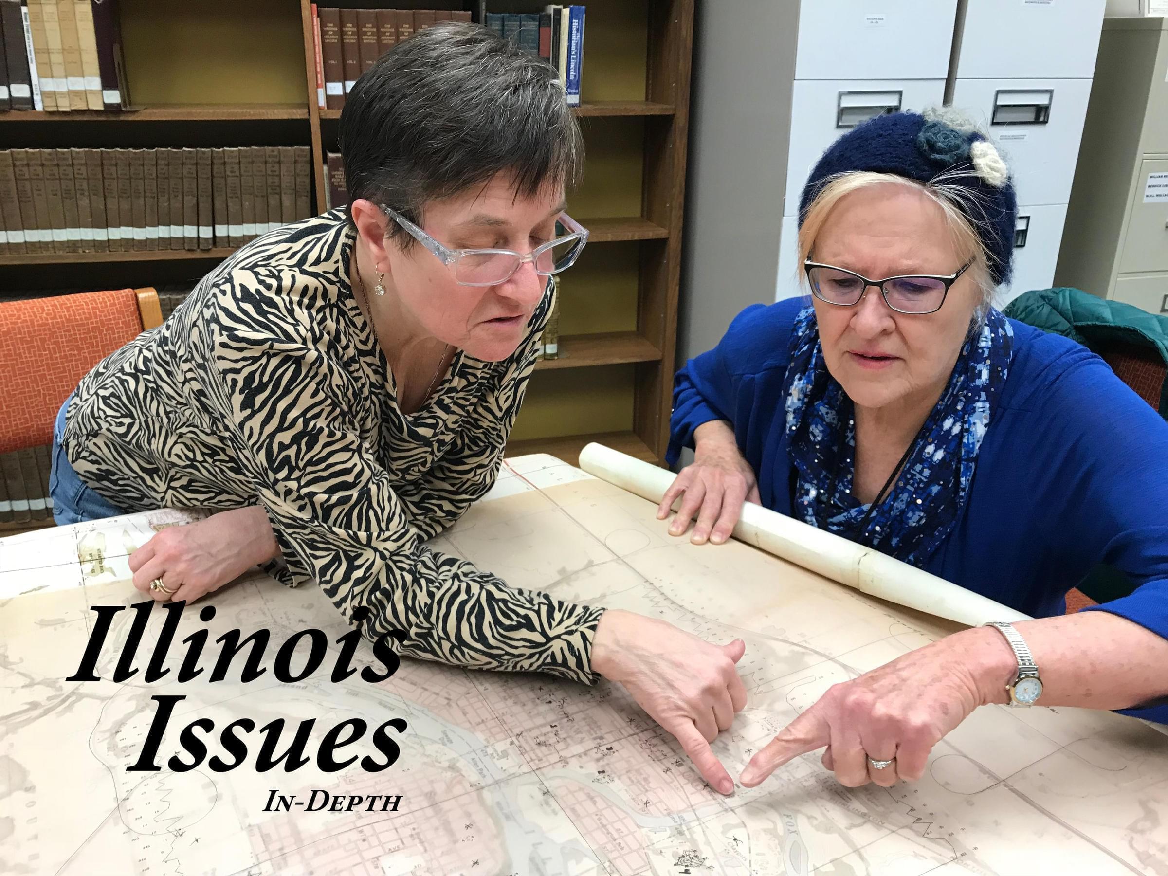 Katie Troccoli and Joan Bernabi review the map created by the department of energy at the Reddick Library. 