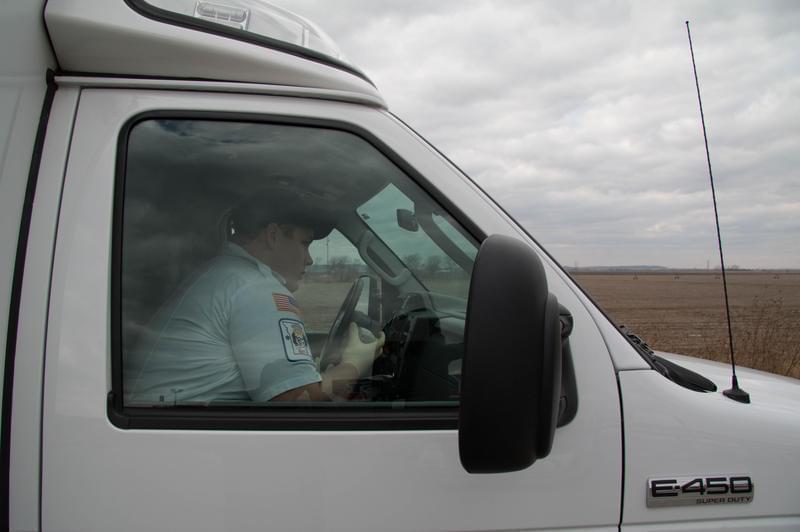 Atchison-Holt EMT Keaton Shaw radios to dispatch that his ambulance is on the scene.