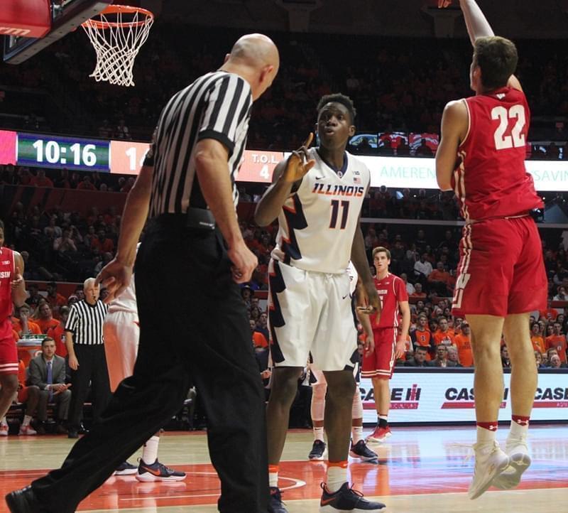 Illinois forward Greg Eboigbodin protests a foul call from referee DJ Carstensen during a 78-69 loss to Wisconsin. 