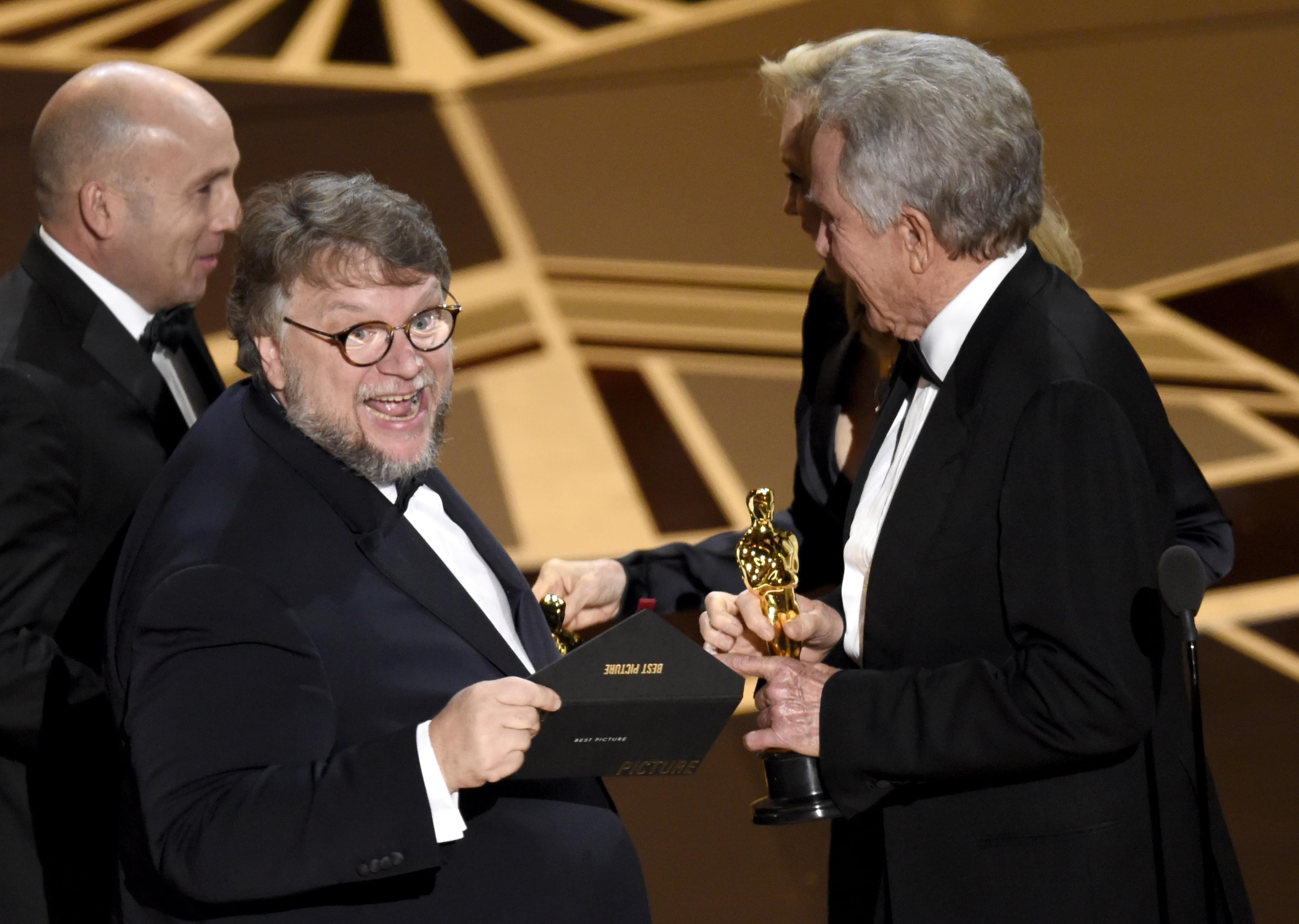 arren Beatty, presents Guillermo del Toro with the award for best picture for "The Shape of Water" at the Oscars.
