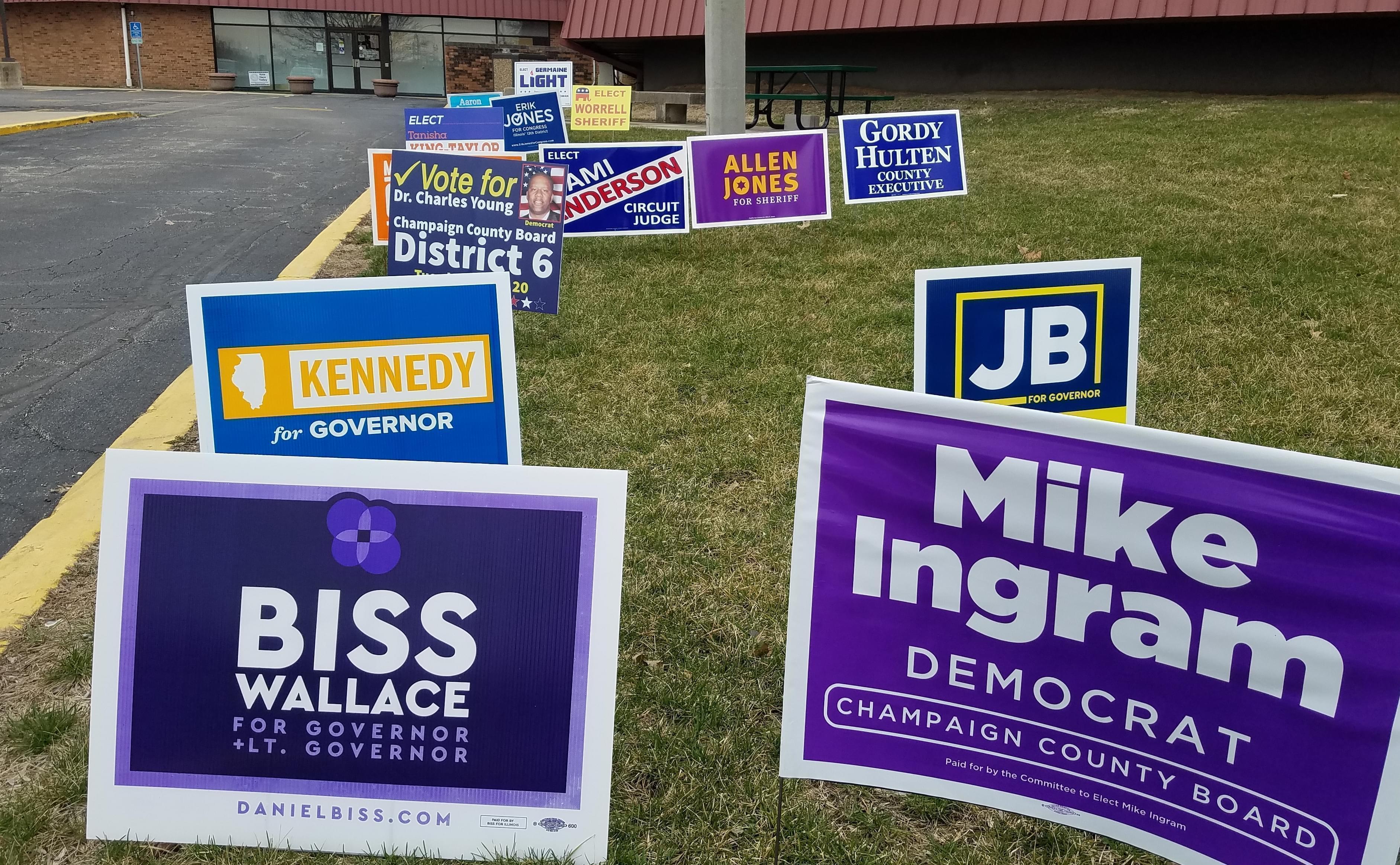 Candidates' signs outside the Champaign County Brookens Center in Urbana.