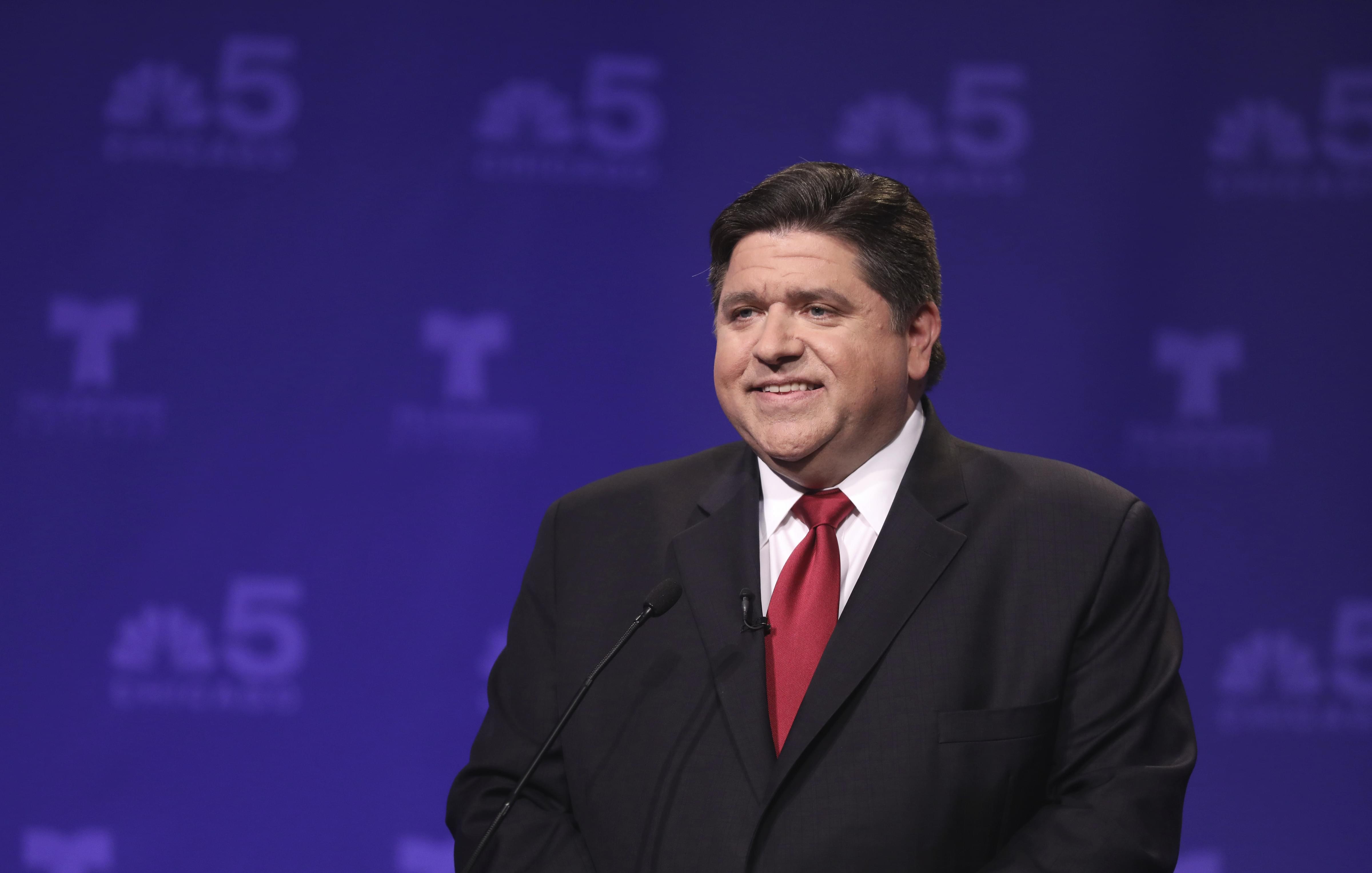 Democratic candidate for Illinois governor J.B. Pritzker takes his podium position before a televised forum Tuesday, Jan. 23, 2018, in Chicago. Pritzker won the Democratic primary for governor. 