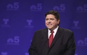 Democratic candidate for Illinois governor J.B. Pritzker takes his podium position before a televised forum Tuesday, Jan. 23, 2018, in Chicago. Pritzker won the Democratic primary for governor. 