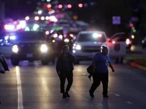 People evacuate as emergency vehicles stage near the site of another explosion on Tuesday in Austin, Texas. 