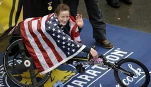 U of I graduate Tatyana McFadden, celebrates after winning the women's wheelchair division of the 122nd Boston Marathon.