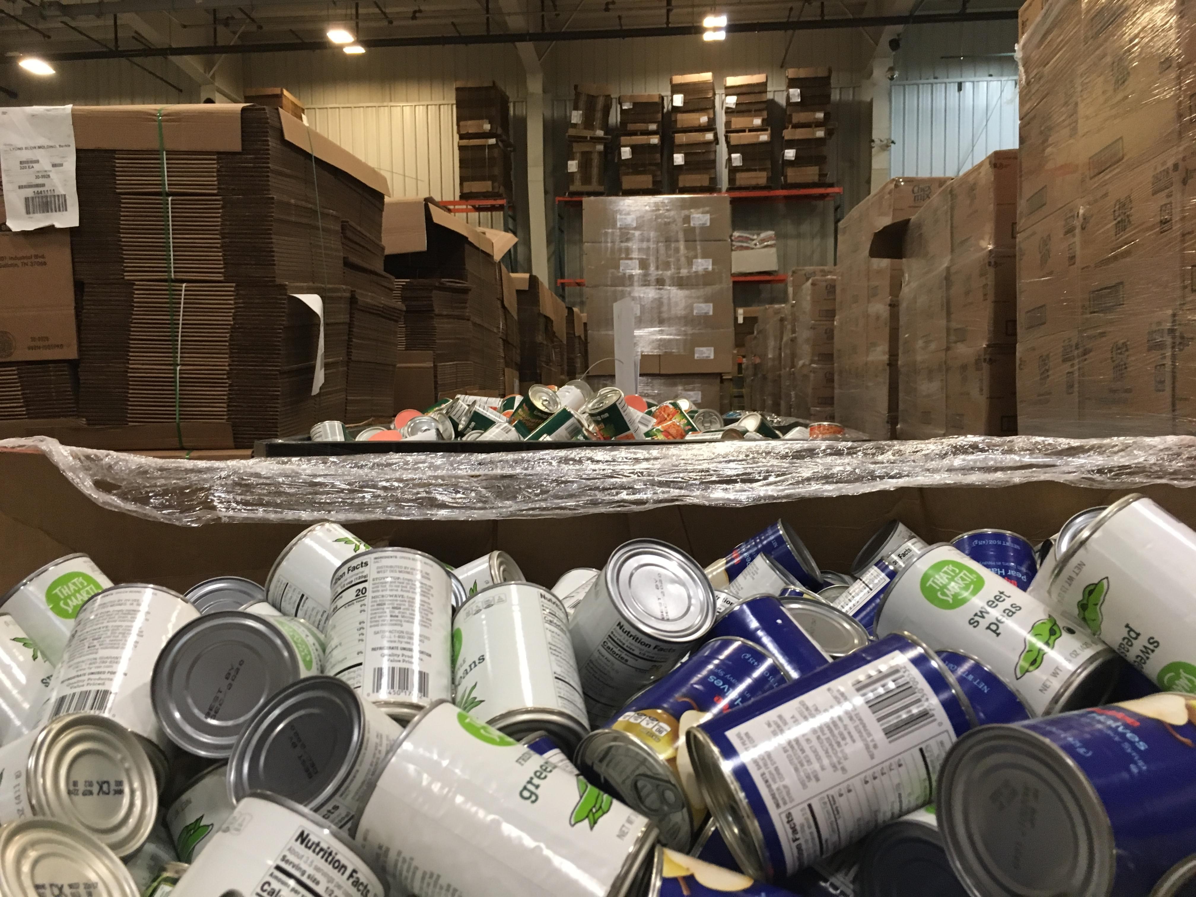 Bins of food wait to be sorted at Harvesters' warehouse in Kansas City, Missouri.