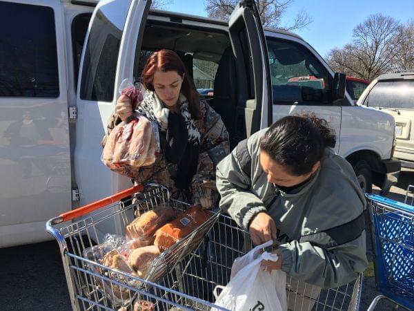 Amy Truckowski (left) and Sandra Viloria, both U.S. Army veterans, carpooled to the Leavenworth Mission Food Pantry in March to pick up a week’s worth of groceries. The pantry is near the U.S. Army installation at Fort Leavenworth. 