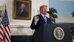 President Donald Trump delivers a statement on the Iran nuclear deal from the Diplomatic Reception Room of the White House, 