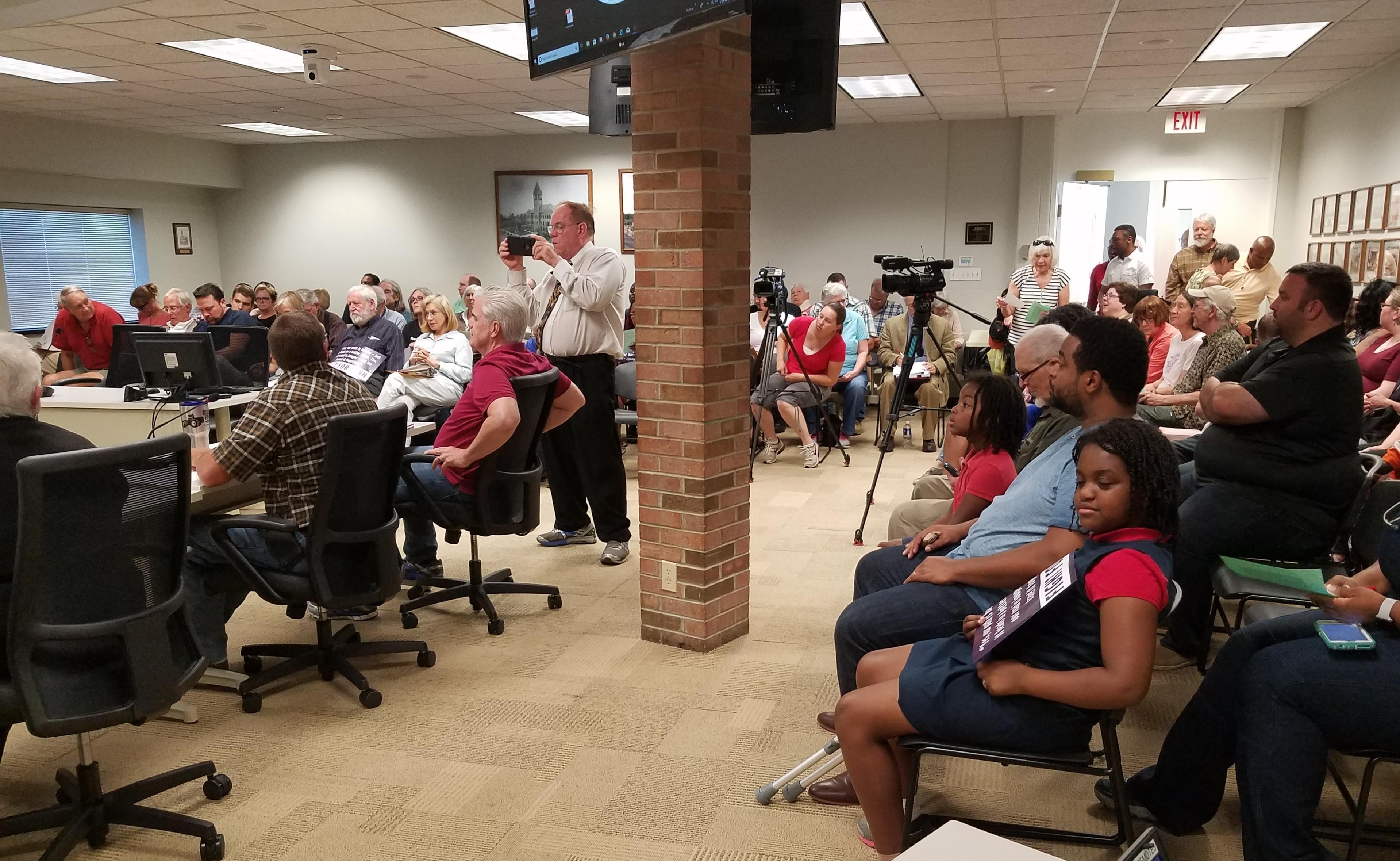More than 100 people came to the Champaign County Board Room at the Brookens Center in Urbana Tuesday evening.