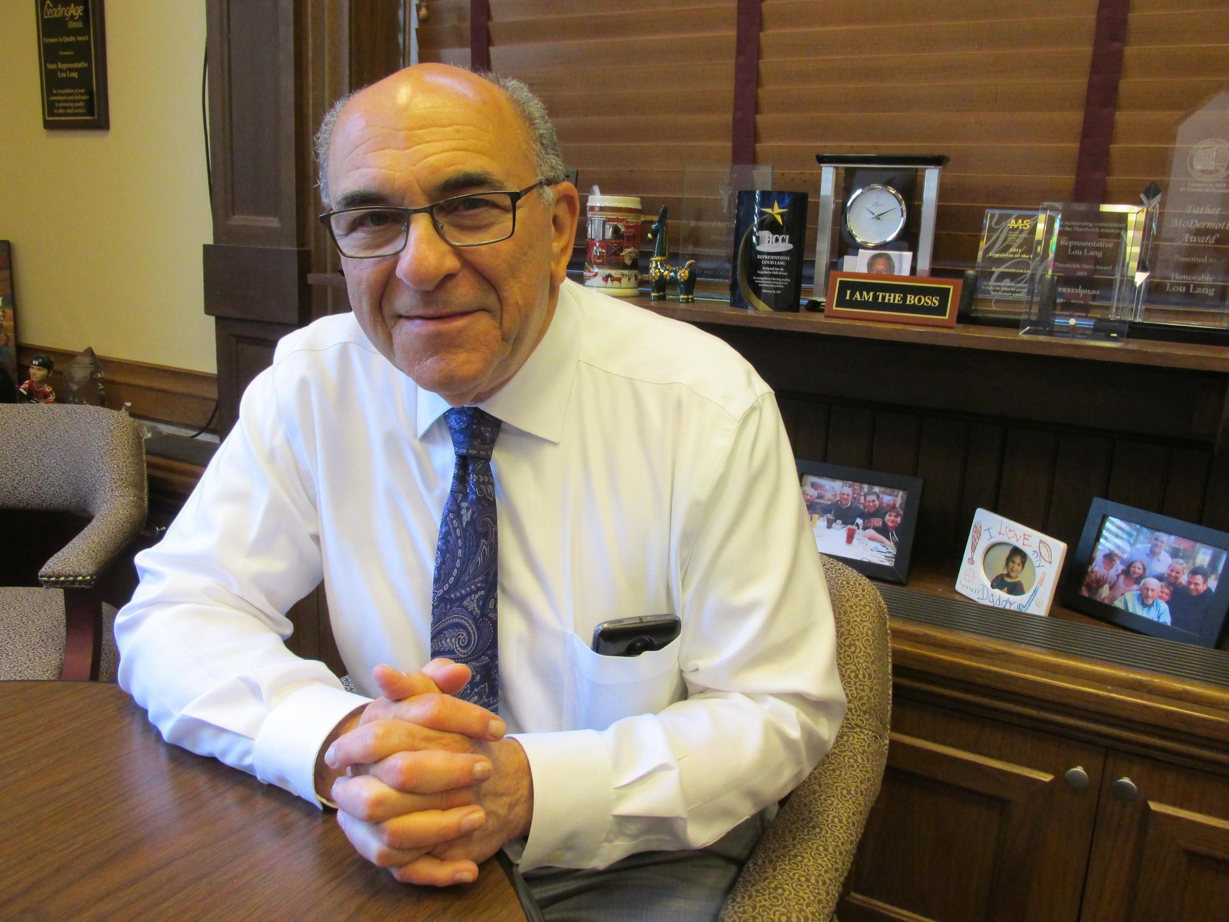 House sponsor of ERA ratification, Rep. Lou Lang in his office at the capitol.