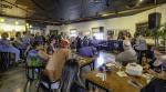 The audience and speakers at the Illinois Newsroom community event News and Brews