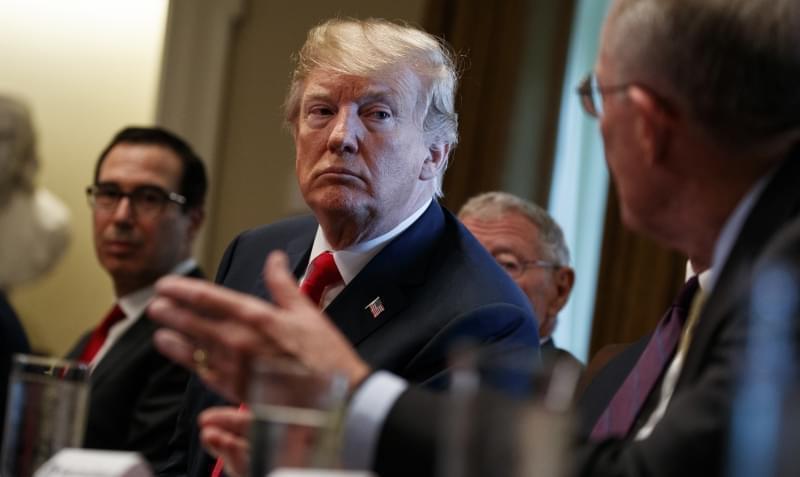 President Donald Trump listens during a meeting with Republican members of Congress. 
