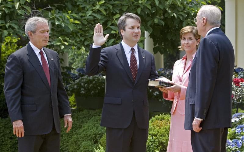 Brett Kavanaugh being sworn in as a federal judge by Supreme Court Justice Anthony Kennedy in 2006. 