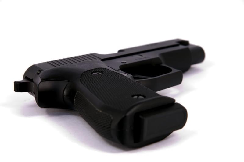 A SIG Sauer P220 45 ACP semiautomatic handgun. 