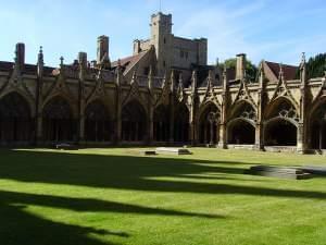 The cloister of Canterbury Cathedral with monastic buildings in the background