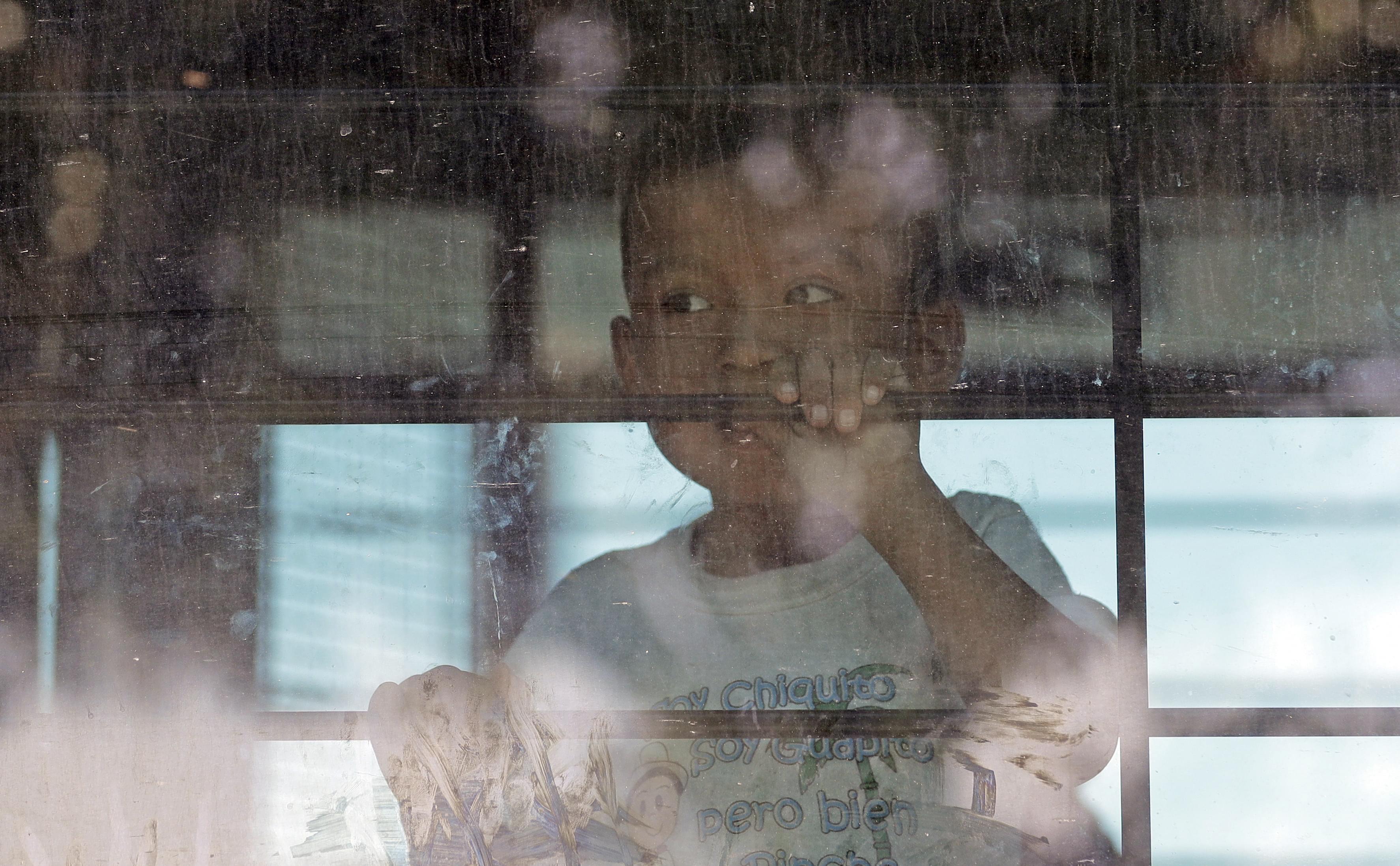 A child looking out a window