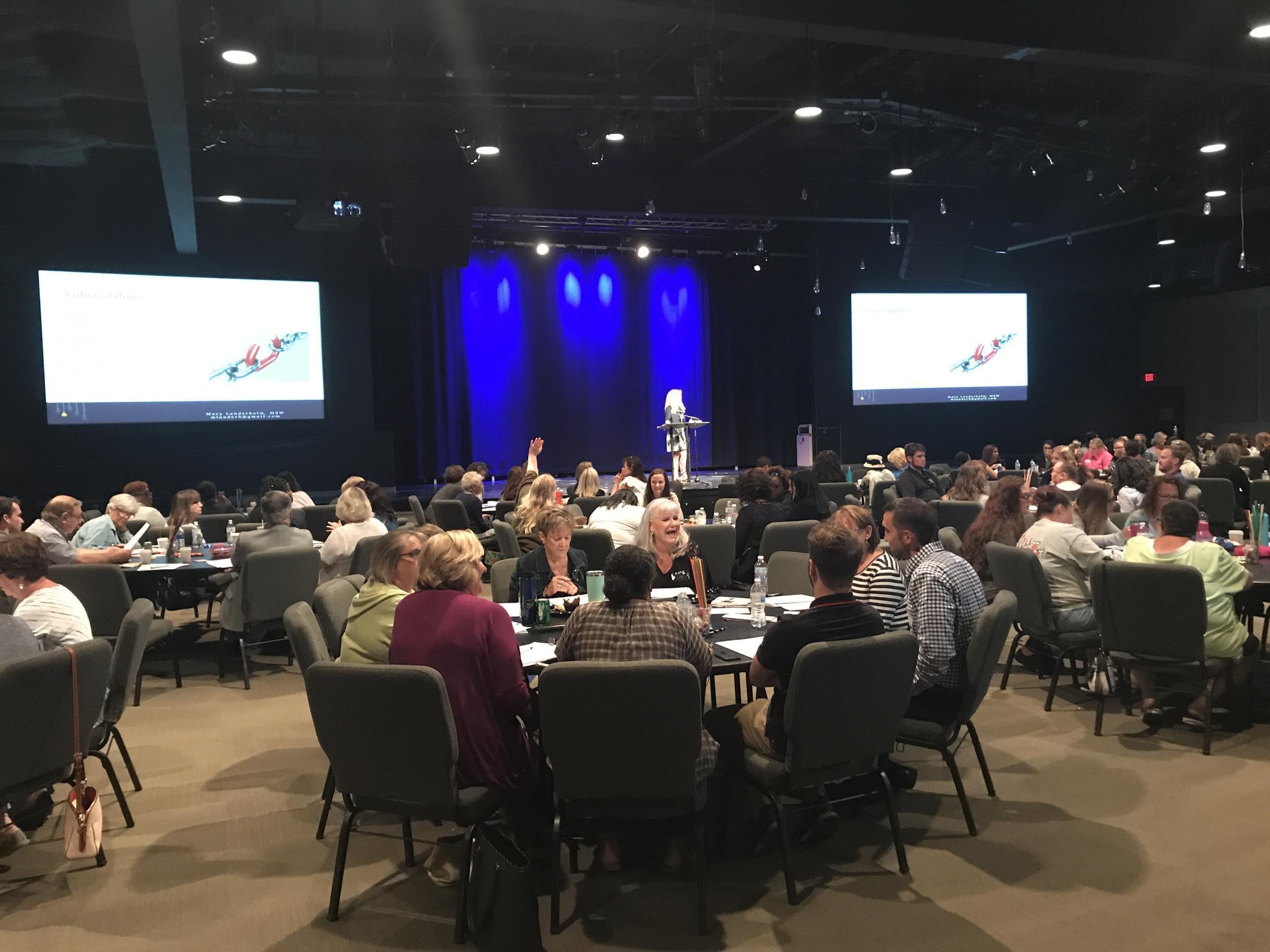 Speakers teaching prevention tools at the Domestic Violence and Human Trafficking summit in Rockford.