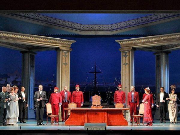 people stand in a line on stage as the Lyric Opera of Chicago performs Così fan tutte