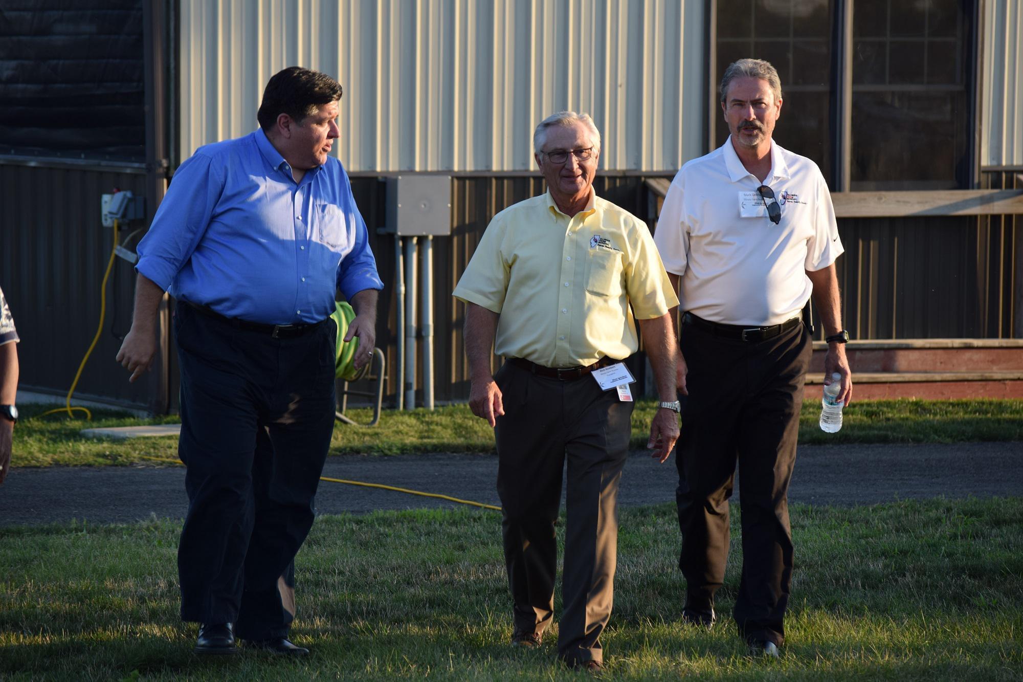 Democratic candidate for governor J.B. Pritzker, left, with Rich Guebert and Mark Gebhards from the Illinois Farm Bureau on Wednesday, Aug. 22, 2018, in Normal.