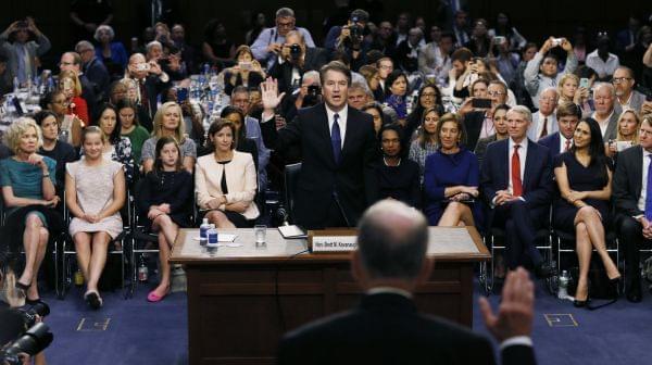 Supreme Court nominee Judge Brett Kavanaugh is sworn in by committee Chairman Chuck Grassley, R-Iowa, to testify during his confirmation hearing on Capitol Hill Tuesday in Washington, D.C. 