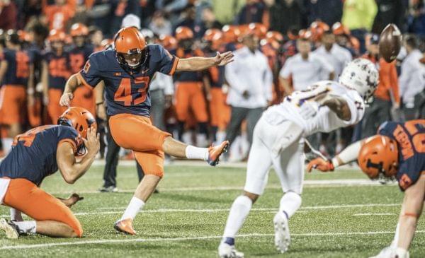 Illinois' Chase McLaughlin kicks an extra point during the first half of their football  game against Western Illinois.