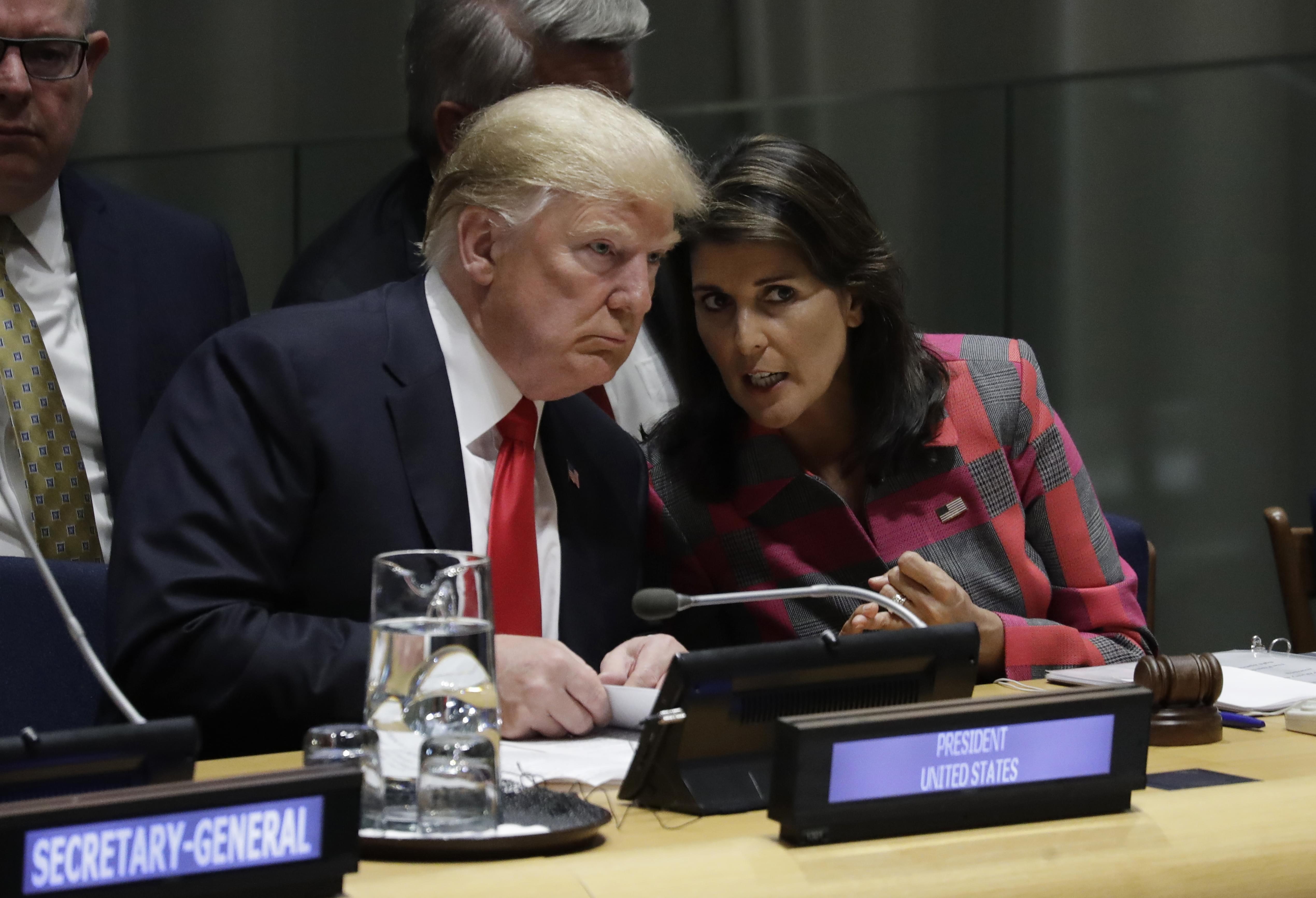 President Donald Trump talks to Nikki Haley, the U.S. ambassador to the United Nations, at the United Nations General Assembly, Monday, Sept. 24, 2018, at U.N. Headquarters.