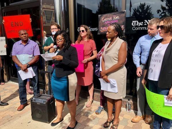 Tanisha King-Taylor, a Democratic candidate for Champaign County Board, shares her "#MeToo" experience during a rally outside of the News-Gazette building on Oct. 1, 2018.