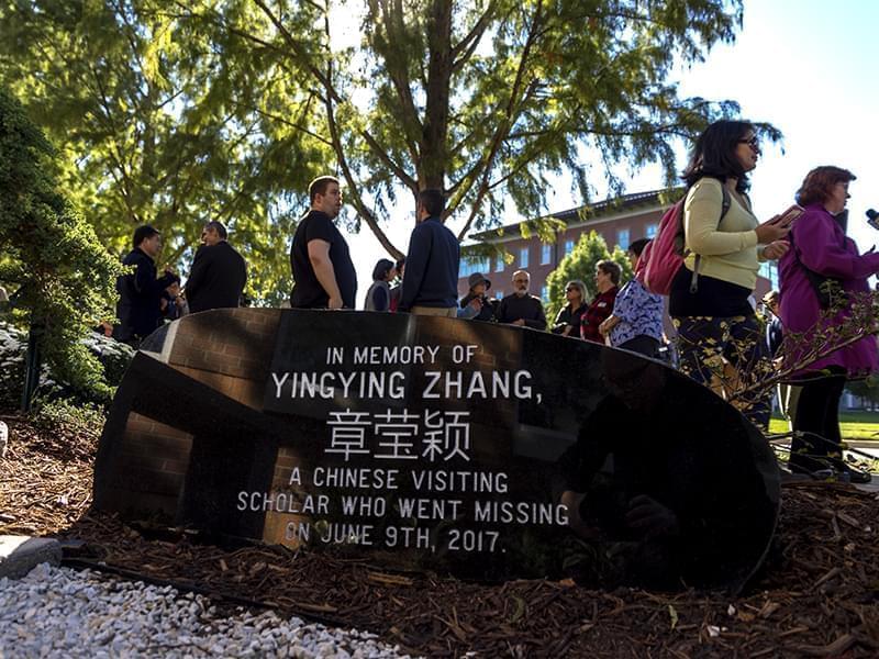 A stone engraved with Yingying Zhang;s name in both English and Chinese in a memorial garden.