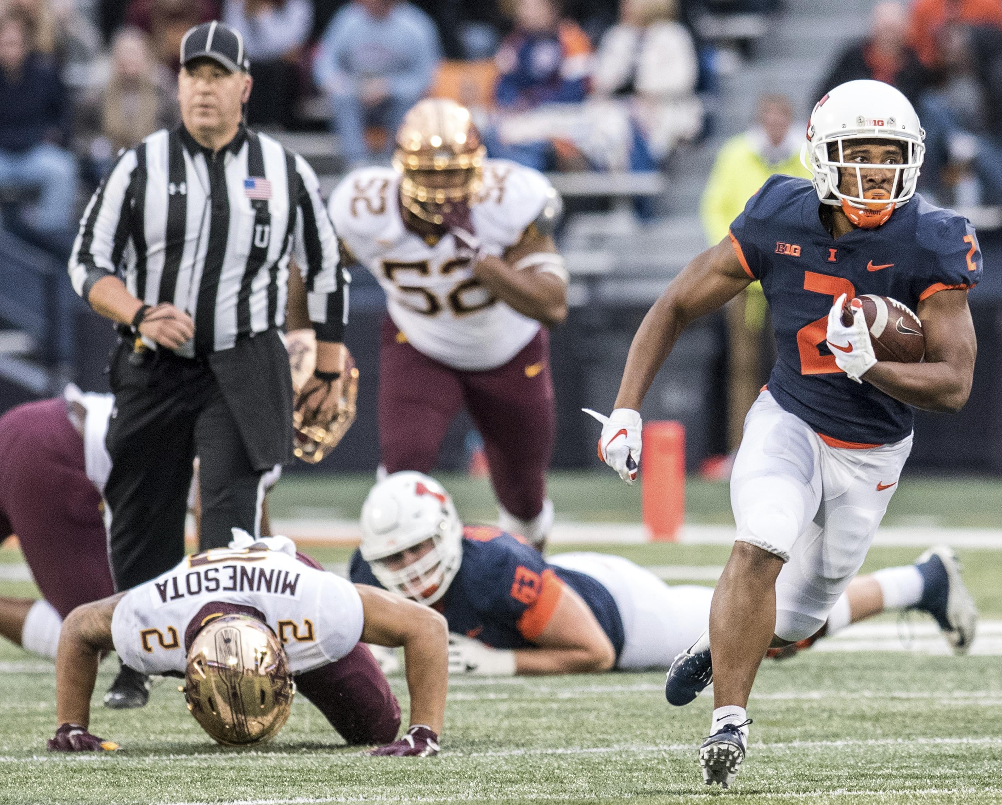 Illinois running back Reggie Corbin breaks away to the end zone.