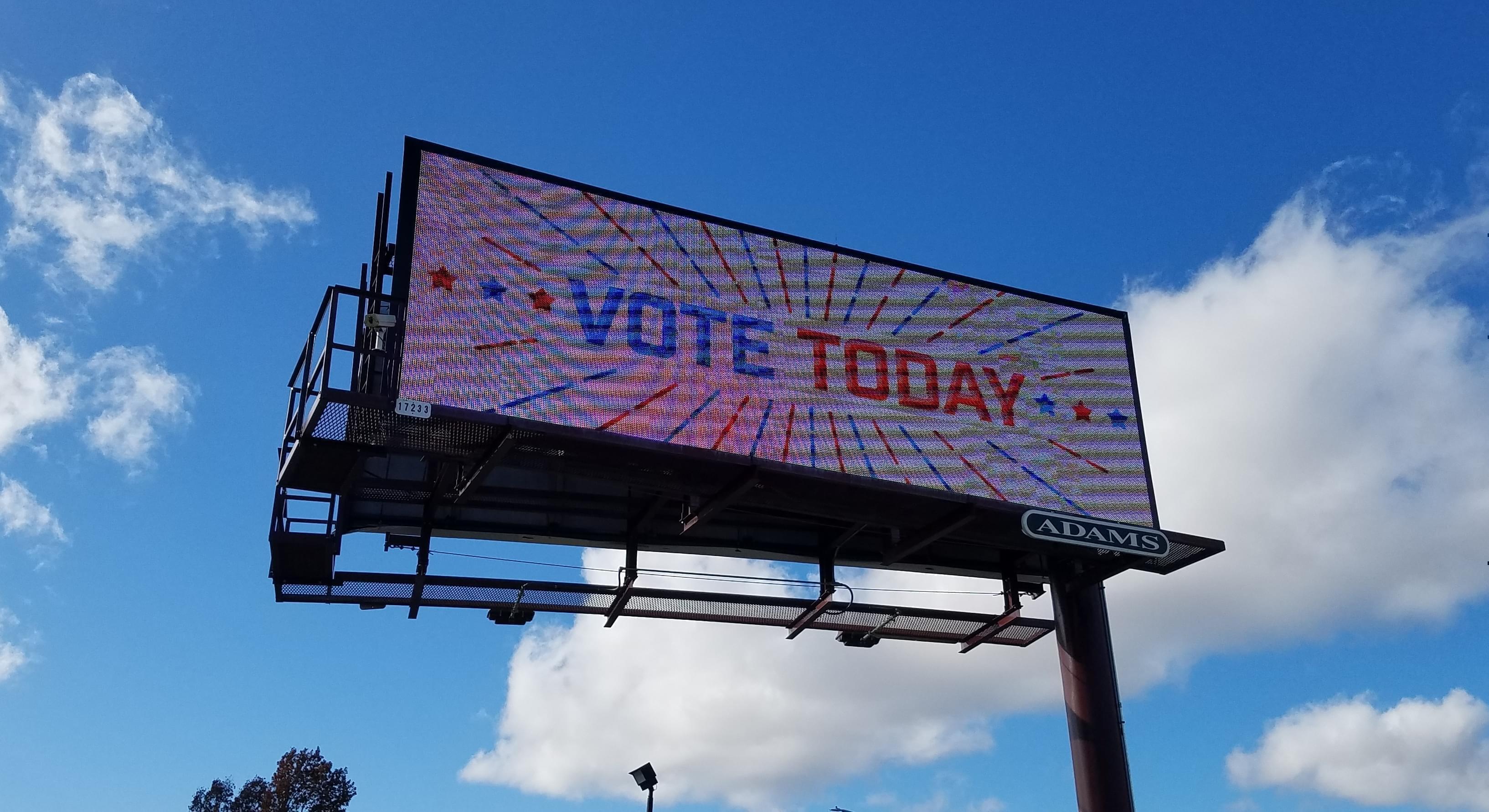 An electronic billboard in Champaign calls on people to vote.