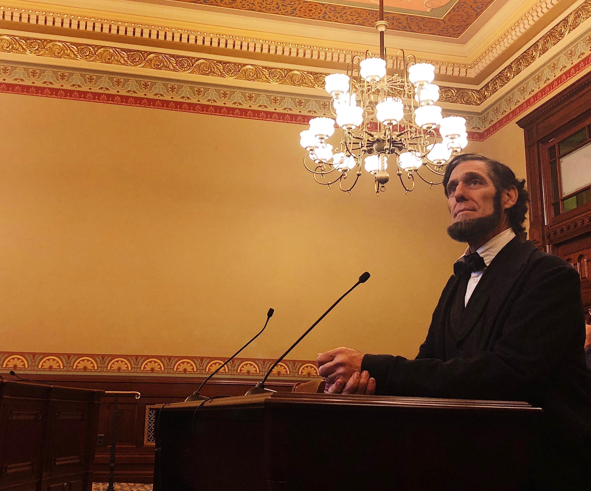 An Abraham Lincoln impersonator opens testimony during a House hearing for the Lincoln museum foundation.