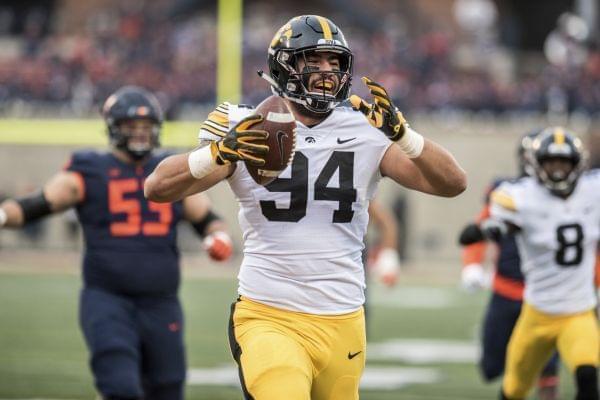 Iowa's A.J. Epenesa (94) celebrates after returning a fumble for a touchdown in the first half of a NCAA college football game against Illinois, Saturday, Nov. 17, 2018, in Champaign, Ill. 