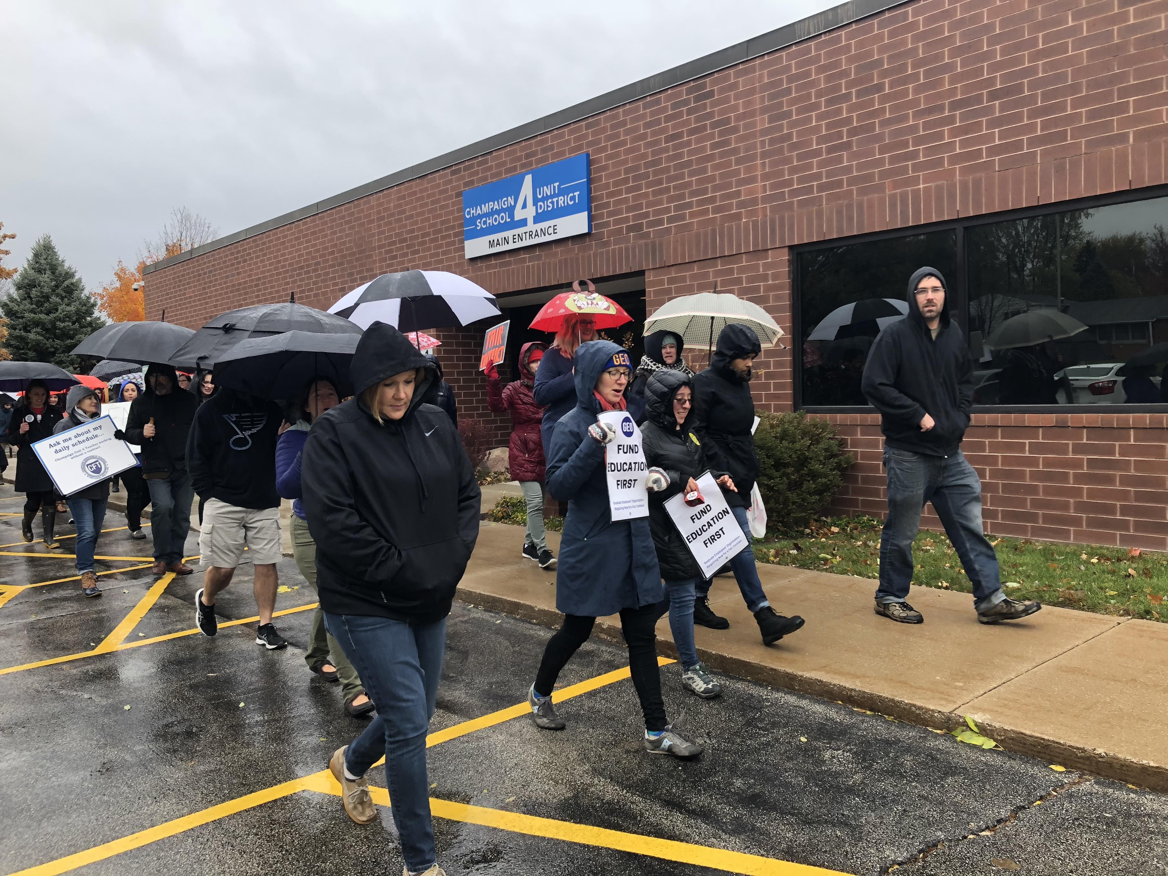 Teachers from Champaign's Unit 4 school district picket outside of the district's administrative offices, Thursday, Nov. 1, 2018. 