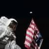 Harrison Schmitt holding an American flag on the Moon