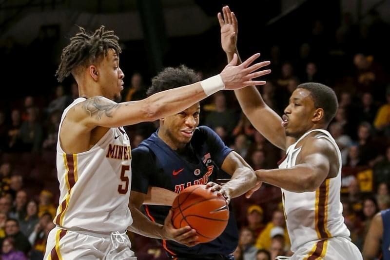 Illinois' Trent Frazier (1) tries to go between Minnesota's Amir Coffey (5) and Isaiah Washington (11) during the second half of an NCAA college basketball game Wednesday, Jan. 30, 2019, in Minneapolis.