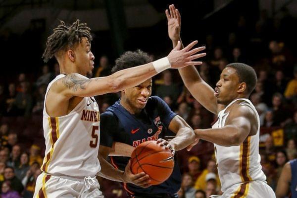 Illinois' Trent Frazier (1) tries to go between Minnesota's Amir Coffey (5) and Isaiah Washington (11) during the second half of an NCAA college basketball game Wednesday, Jan. 30, 2019, in Minneapolis.