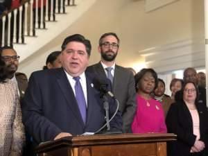 Governor JB Pritzker at the signing ceremony for legislation raising the state minimum wage.