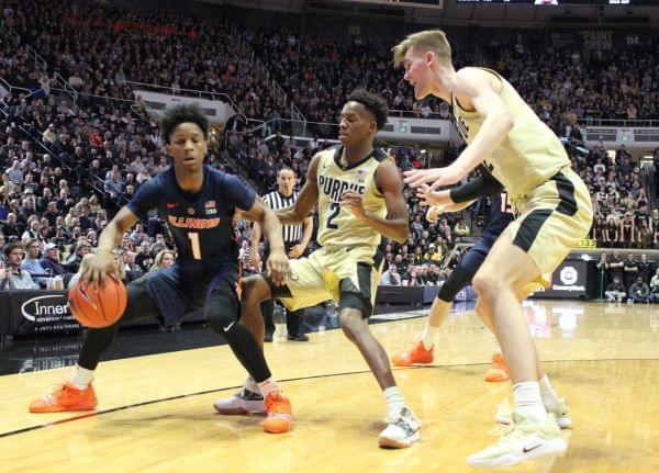 Purdue's Matt Haarms (right) and Eric Hunter defend Illinois' Trent Frazier during Purdue's 73-56 win Wednesday night in West Lafayette, Indiana.