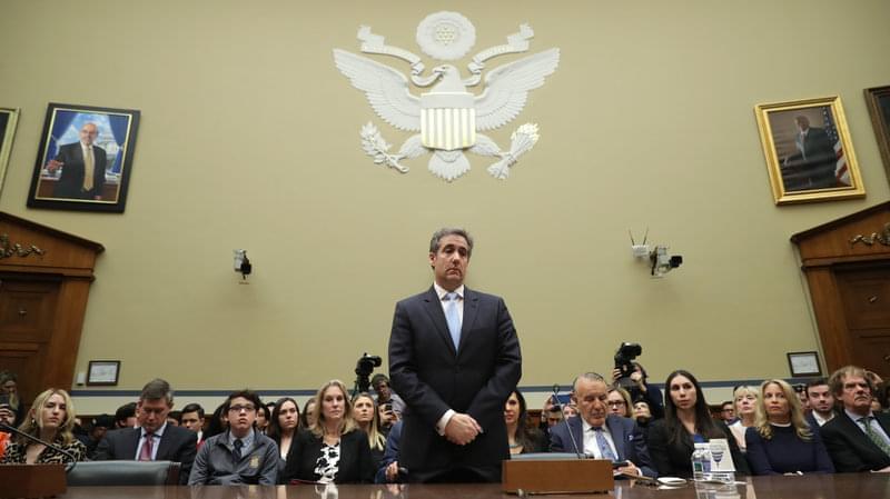 Michael Cohen prepares to testify before the House oversight committee on Capitol Hill Wednesday in Washington, D.C. 
